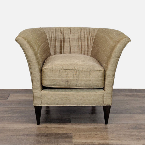Front view of a Reperch lounge chair with satin-like upholstery and dark wood legs.  