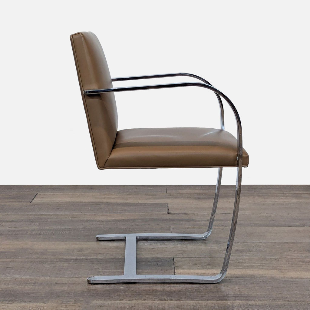 Side view of the Reperch Brno chair with cantilevered chrome frame and upholstered leather seat and back.