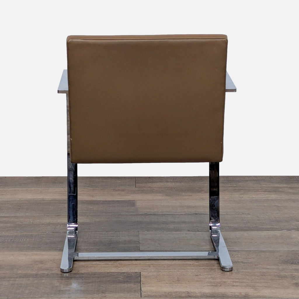 Back view of the Reperch Brno chair, showcasing the brown leather upholstery and sleek chrome frame.