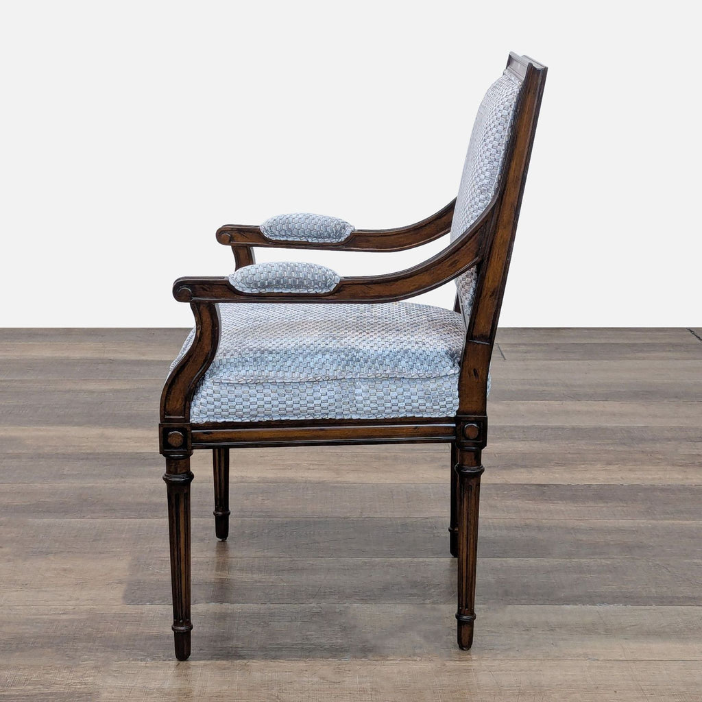 Side view of a Pearson chair with a detailed armrest design.