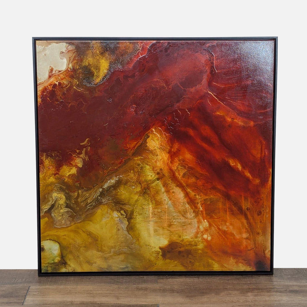 Abstract canvas print in black frame, featuring warm earthy tones.