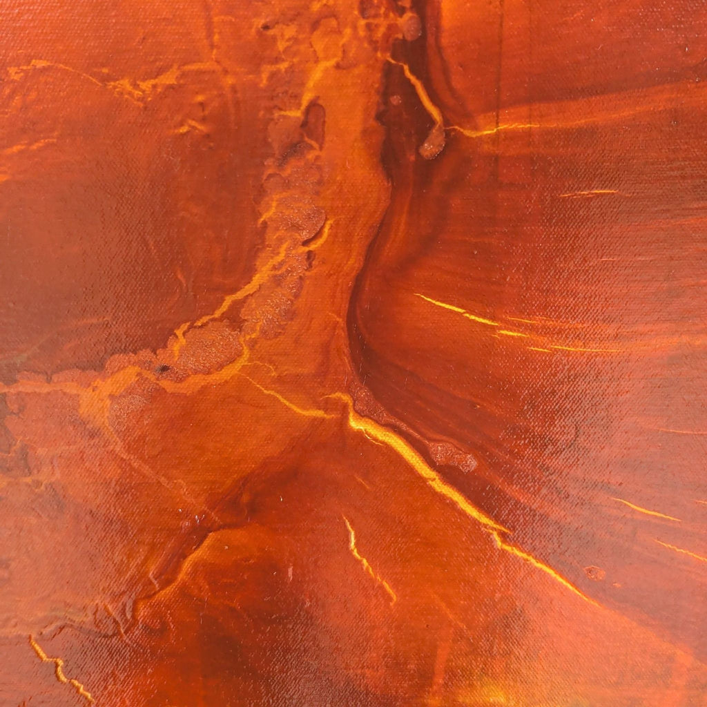 Detail of abstract artwork showcasing textured layers in fiery colors.