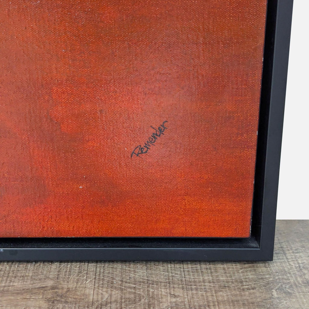 Close-up view of abstract painting by Reperch, featuring rich red hues in a black frame.