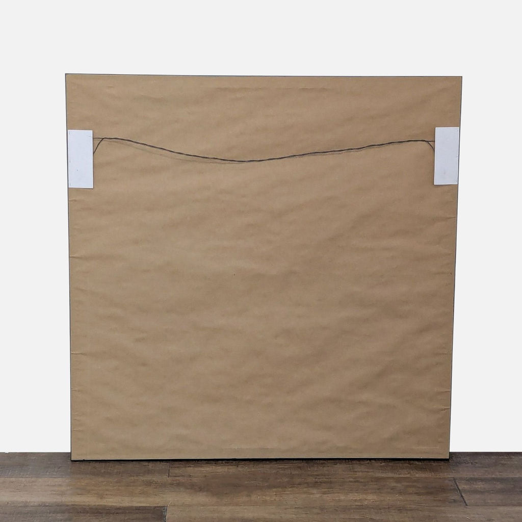 Back view of framed abstract artwork with wire for hanging installation.