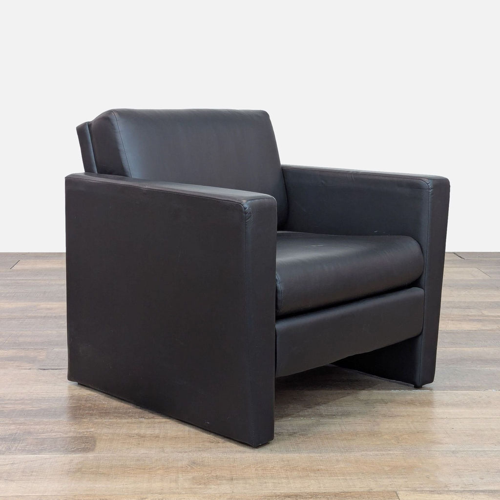 Modern Pennant lounge chair with faux leather, angled view.