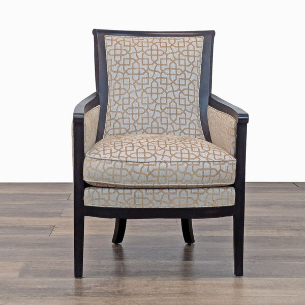 Front view of a patterned armchair with an exposed wood frame and cushioned seat. 