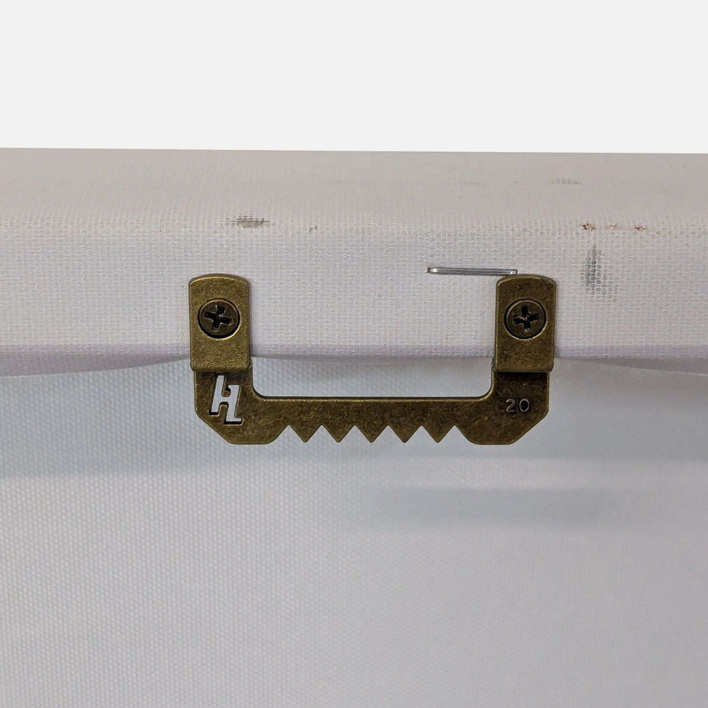 Close-up of the canvas's hanging hardware on the back.