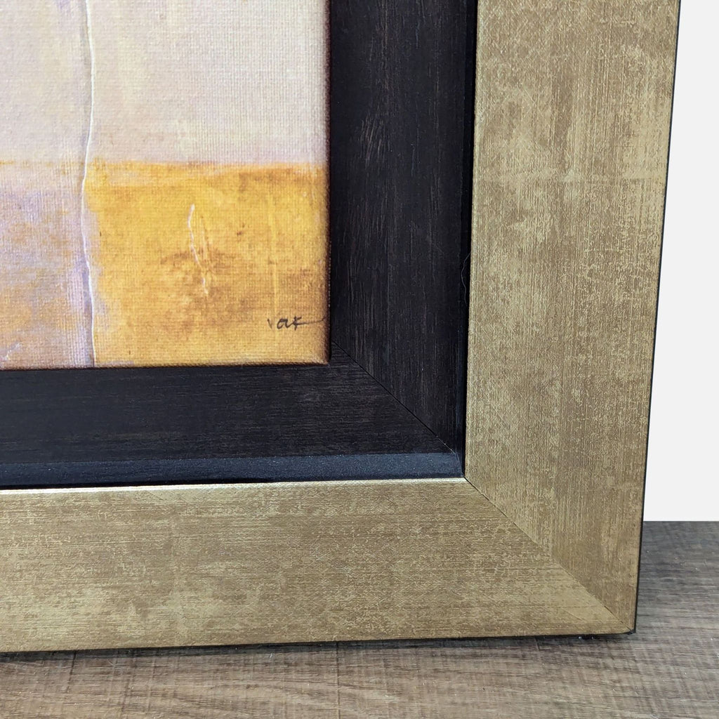 Close-up of the corner of the framed abstract print "Warmth" by Volk.