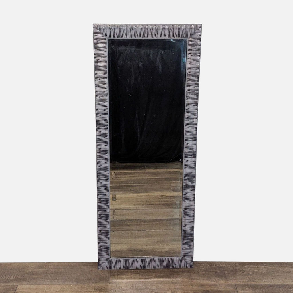 Full-length mirror with a textured frame by Reperch.