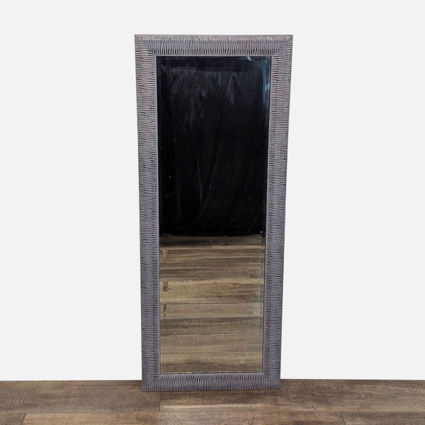 Full-length mirror with a textured frame by Reperch.