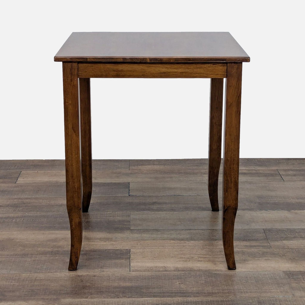 Wooden square table and two matching chairs, part of dining set from World Market.  
