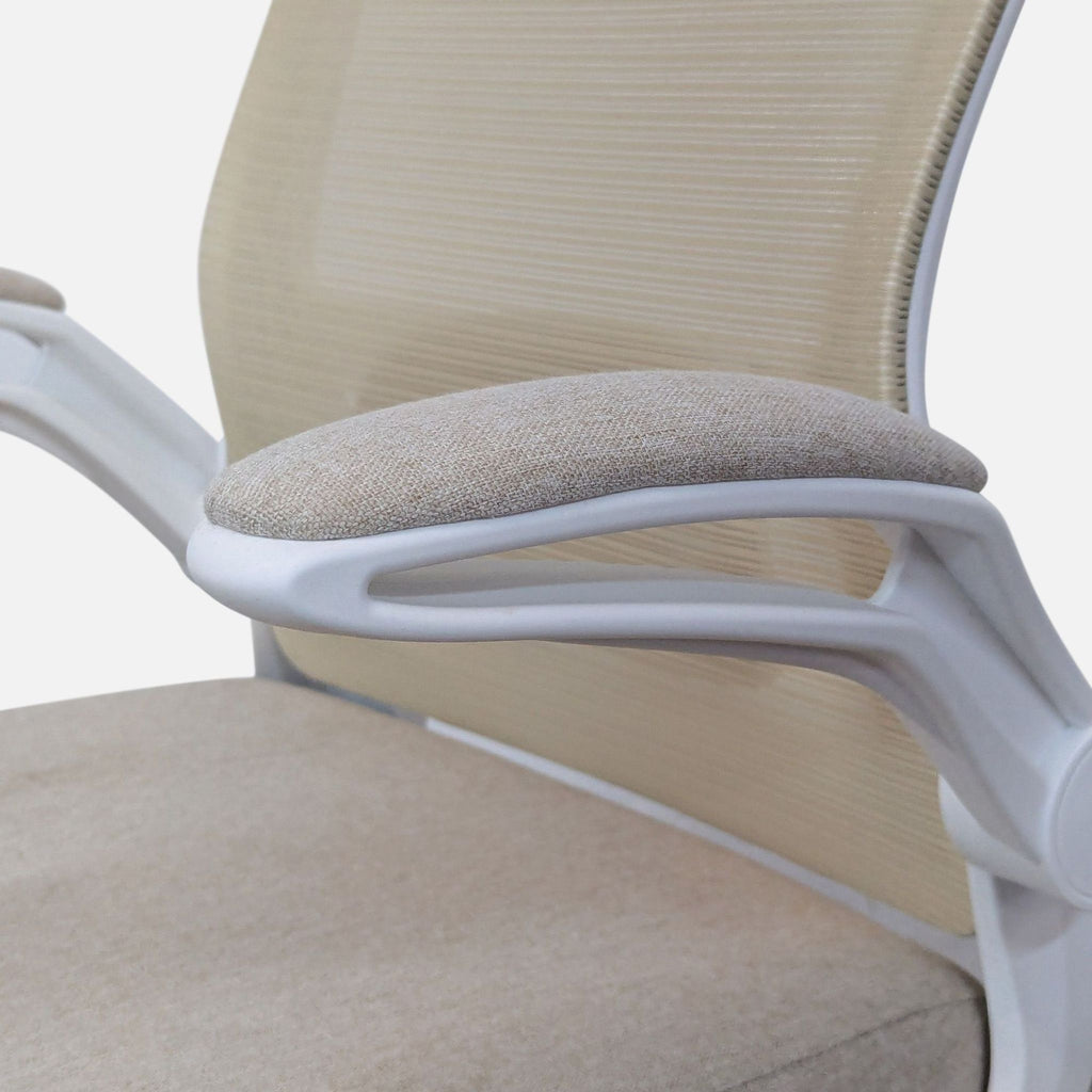 Close-up of Reperch chair armrest with lumbar support.