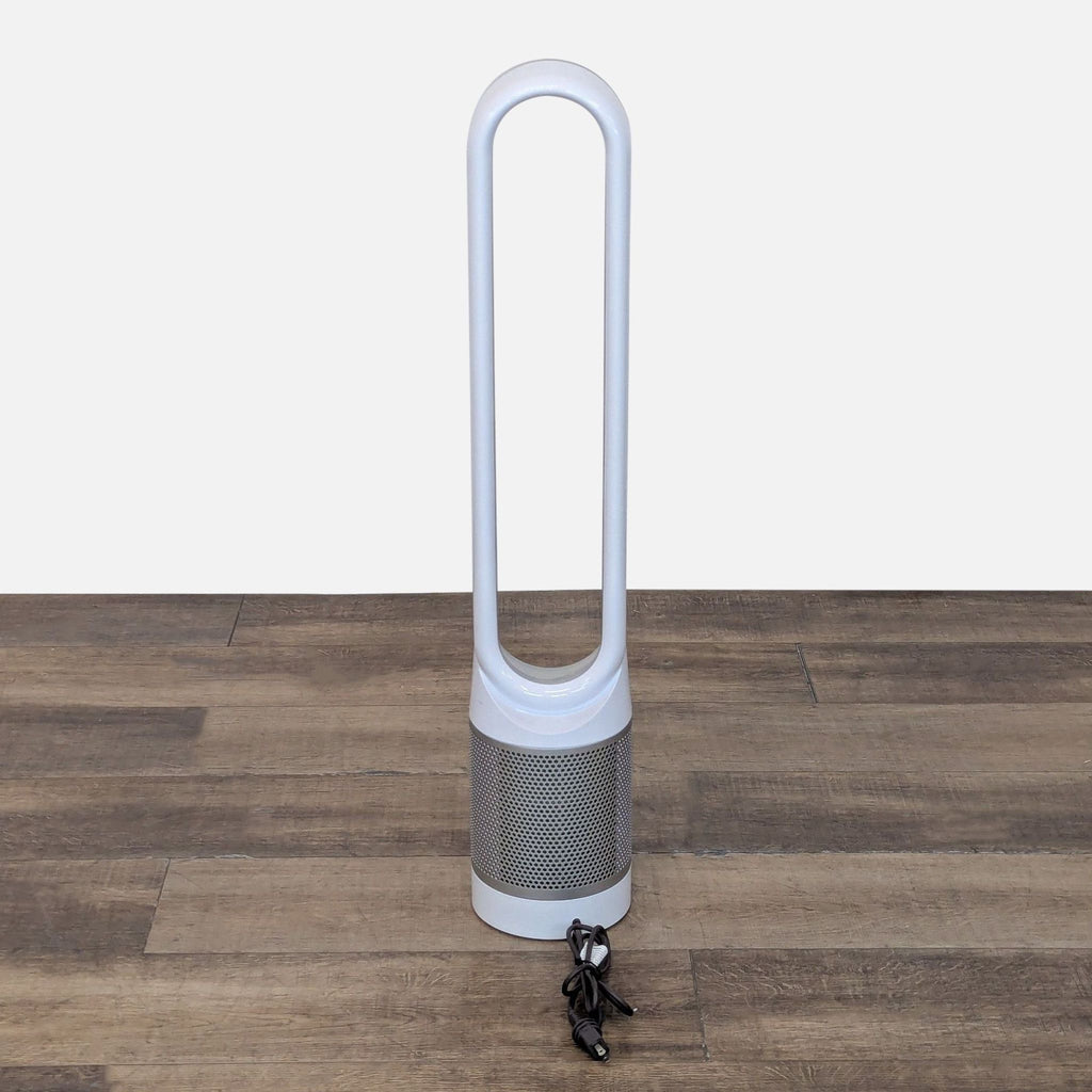 2. Reperch tower fan, bladeless and white, displayed from the front with cord resting at the base, on wood floor.