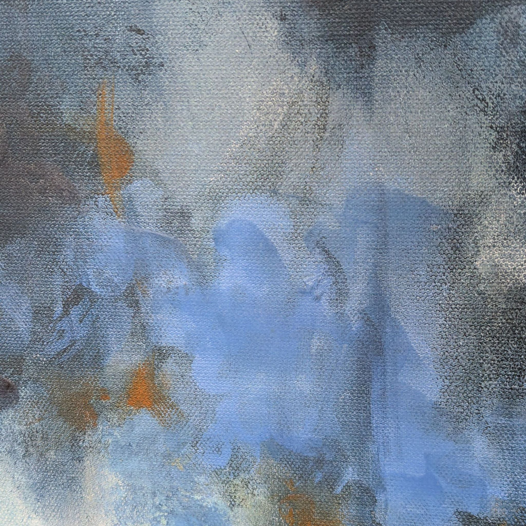 Detailed view of blue and orange brushstrokes on canvas.