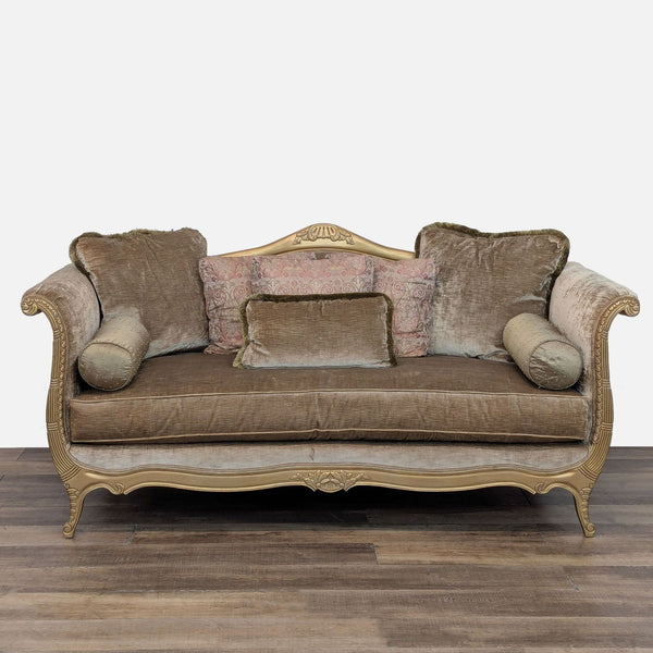 Wooden-framed sofa with velvet upholstery and decorative pillows by Drexel Heritage.