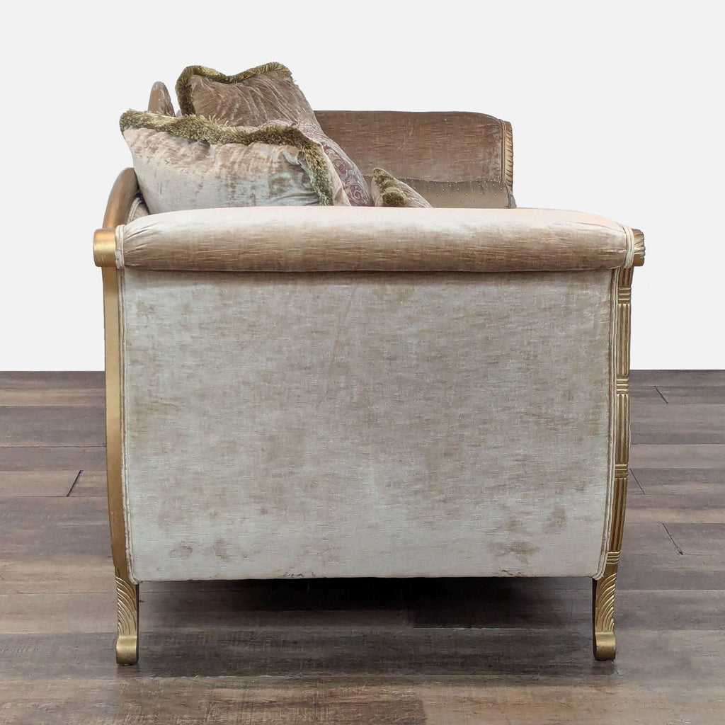 Side view of a Drexel Heritage 3-seater sofa with carved detailing and plush pillows.