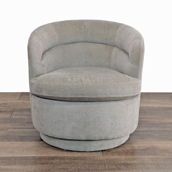 Front view of West Elm's barrel back lounge chair with a 360-degree swivel base.