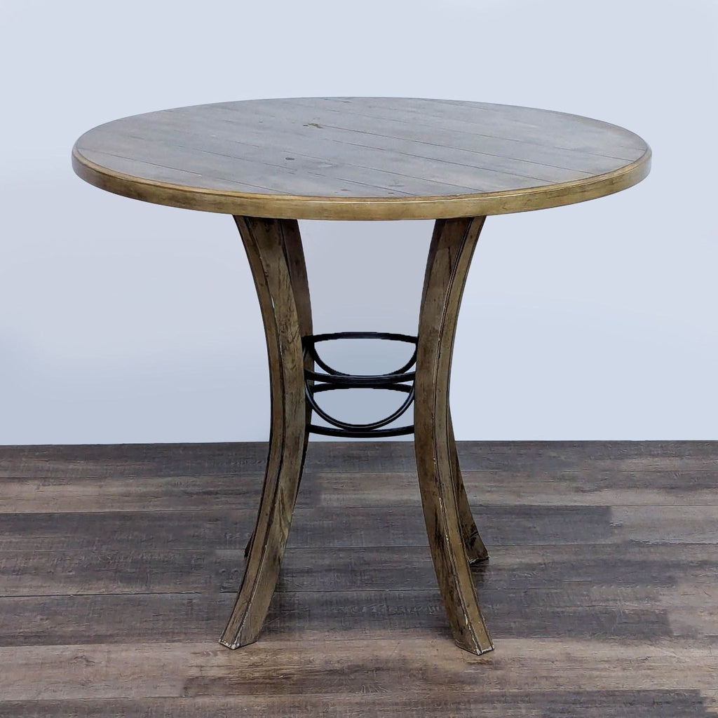 Side view of Reperch dining table showcasing curved metal legs and wood surface.  