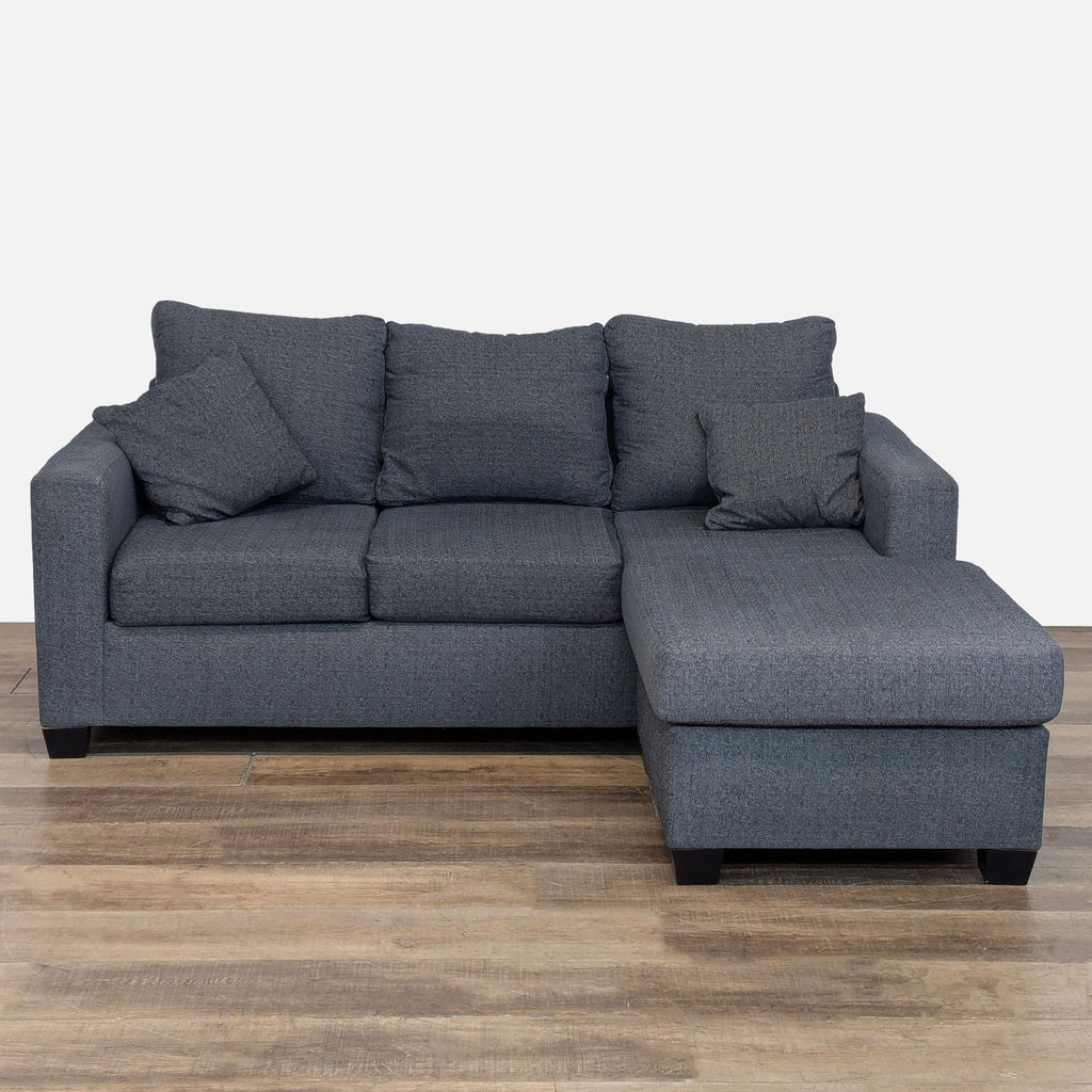 Modular sectional with reversible chaise, track arms, and wood feet, by Juanillo Furniture.  