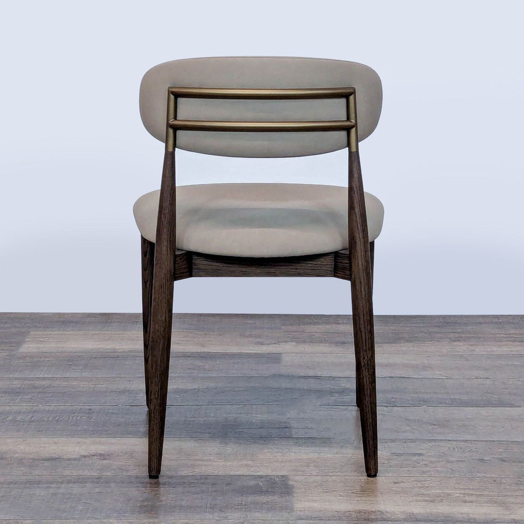 Back view of an RH dining chair featuring a beige cushioned backrest and metallic support bars.