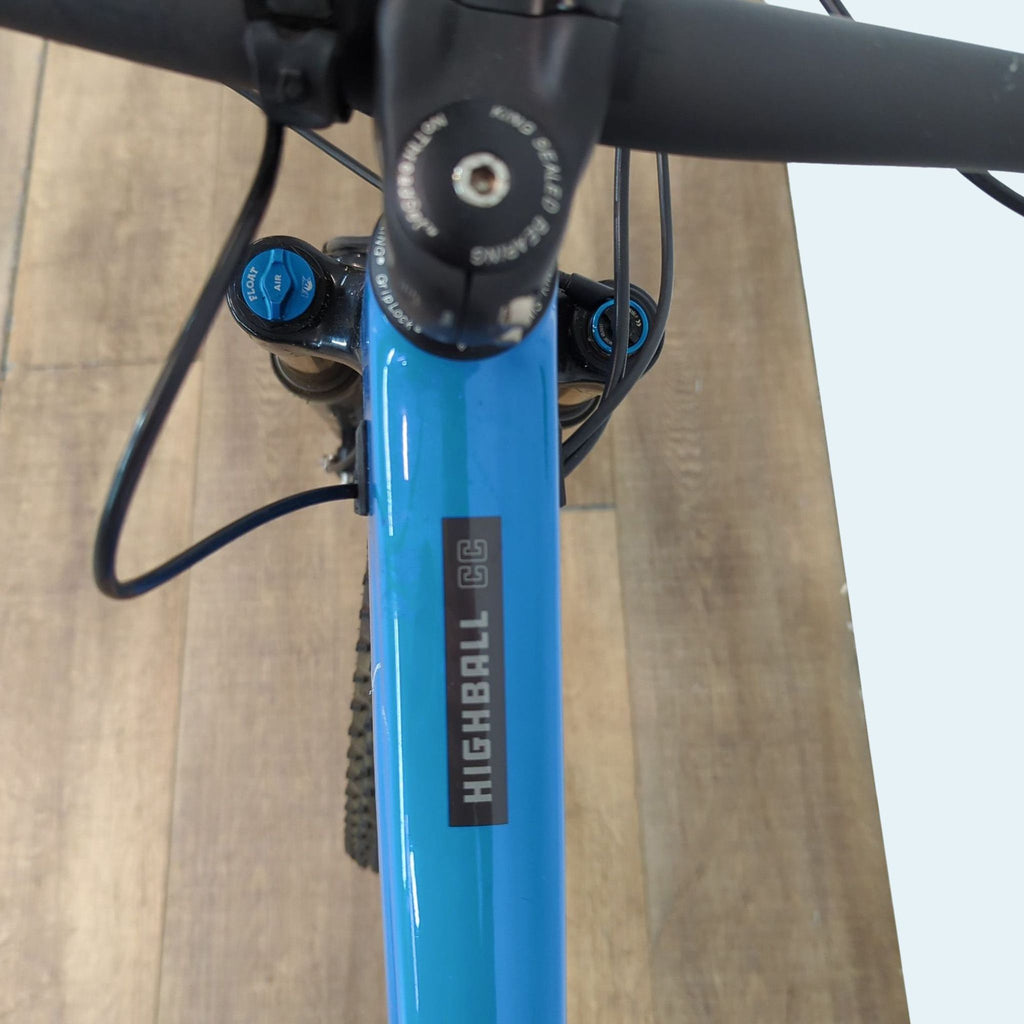 Close-up of bike's top tube, showing "Highball CC" branding.