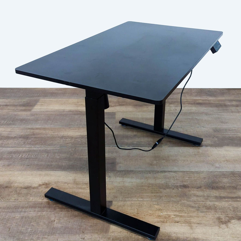 Side view of SHW desk featuring sleek black finish and adjustable height.