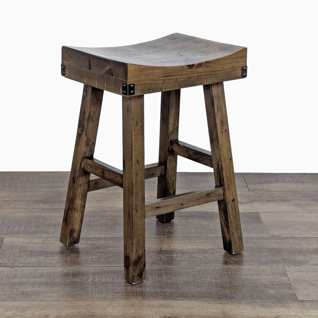 Angled view of a wooden stool made from reclaimed materials, suitable for various settings.