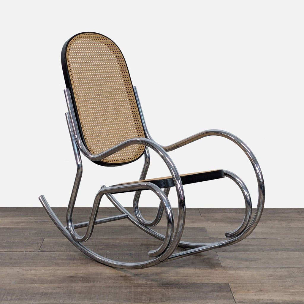 Angled view of British vintage rocking chair with chromed frame and woven rattan.