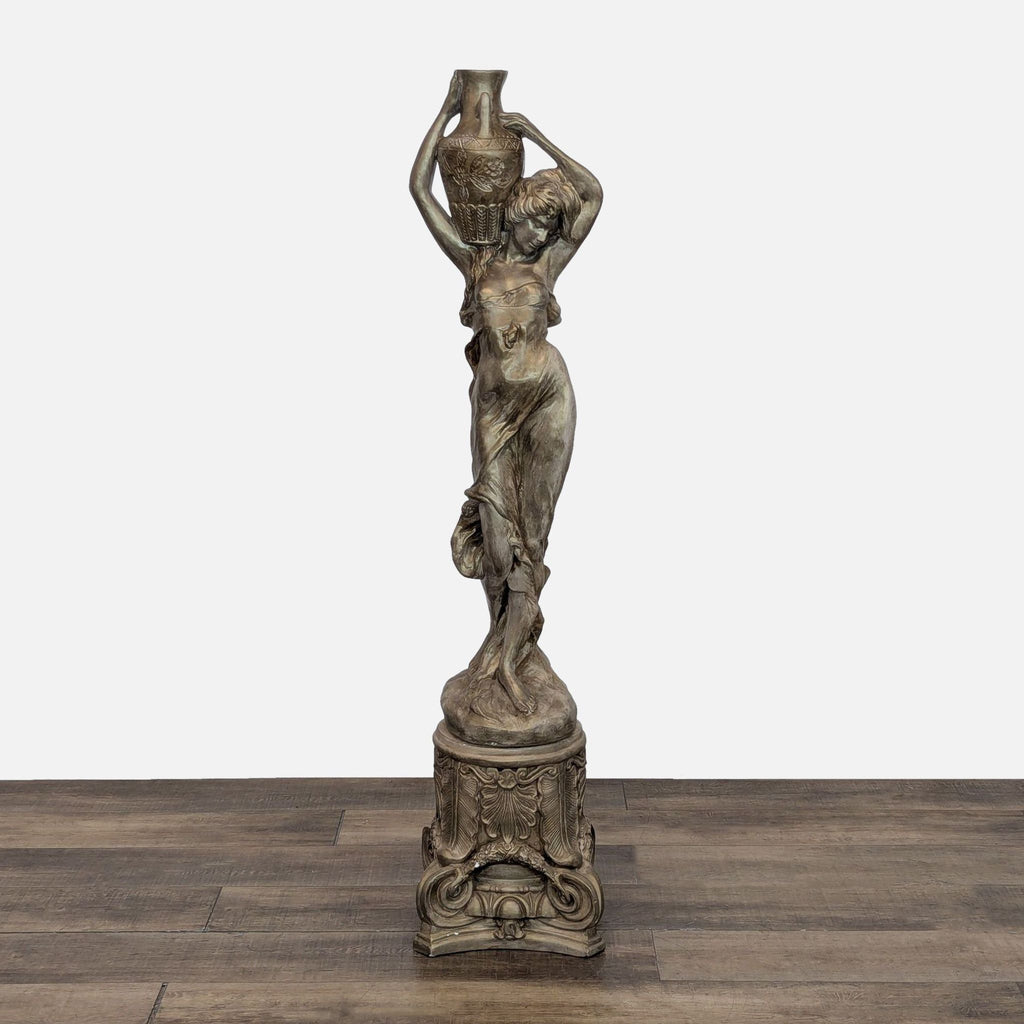 Elegant stone statue of a woman with urn on head, detailed and suitable for garden decor.