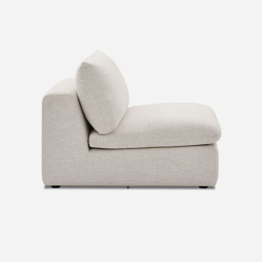 Side view of a cream-colored lounge chair with removable cushions by Castlery.