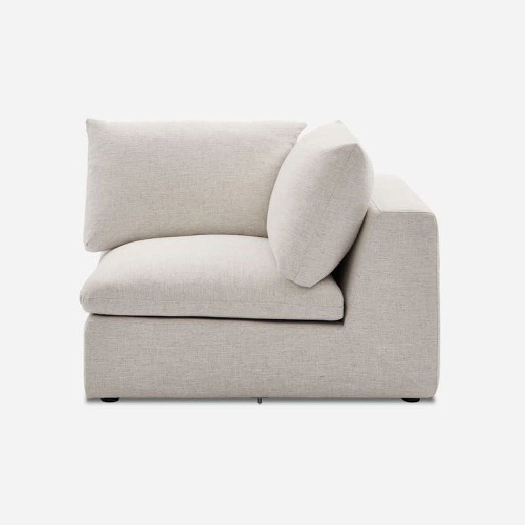 Castlery sectional corner piece in Beach Linen fabric with feather-filled cushions.