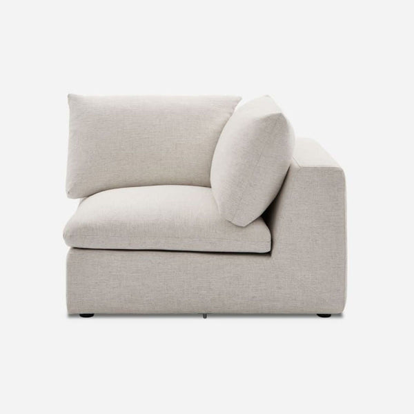 Castlery sectional corner piece in Beach Linen fabric with feather-filled cushions.