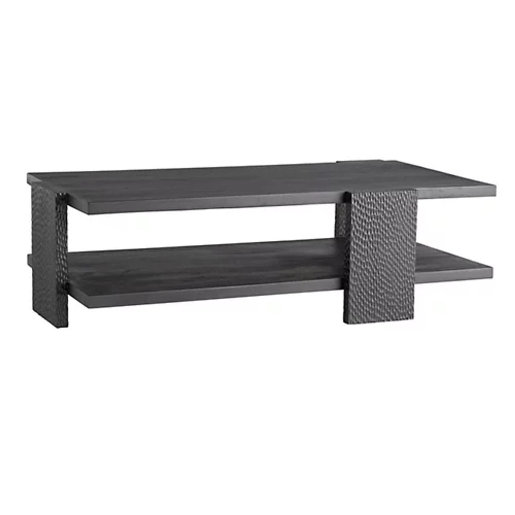 Hand-carved mango wood coffee table by Arteriors Home, featuring textured legs and a soft waxed finish.