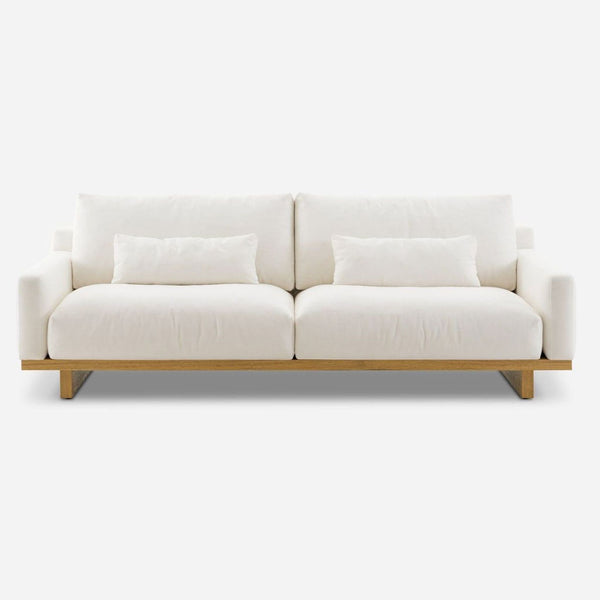 Front view of a 3-seat Castlery sofa with Alpine fabric and wooden legs.