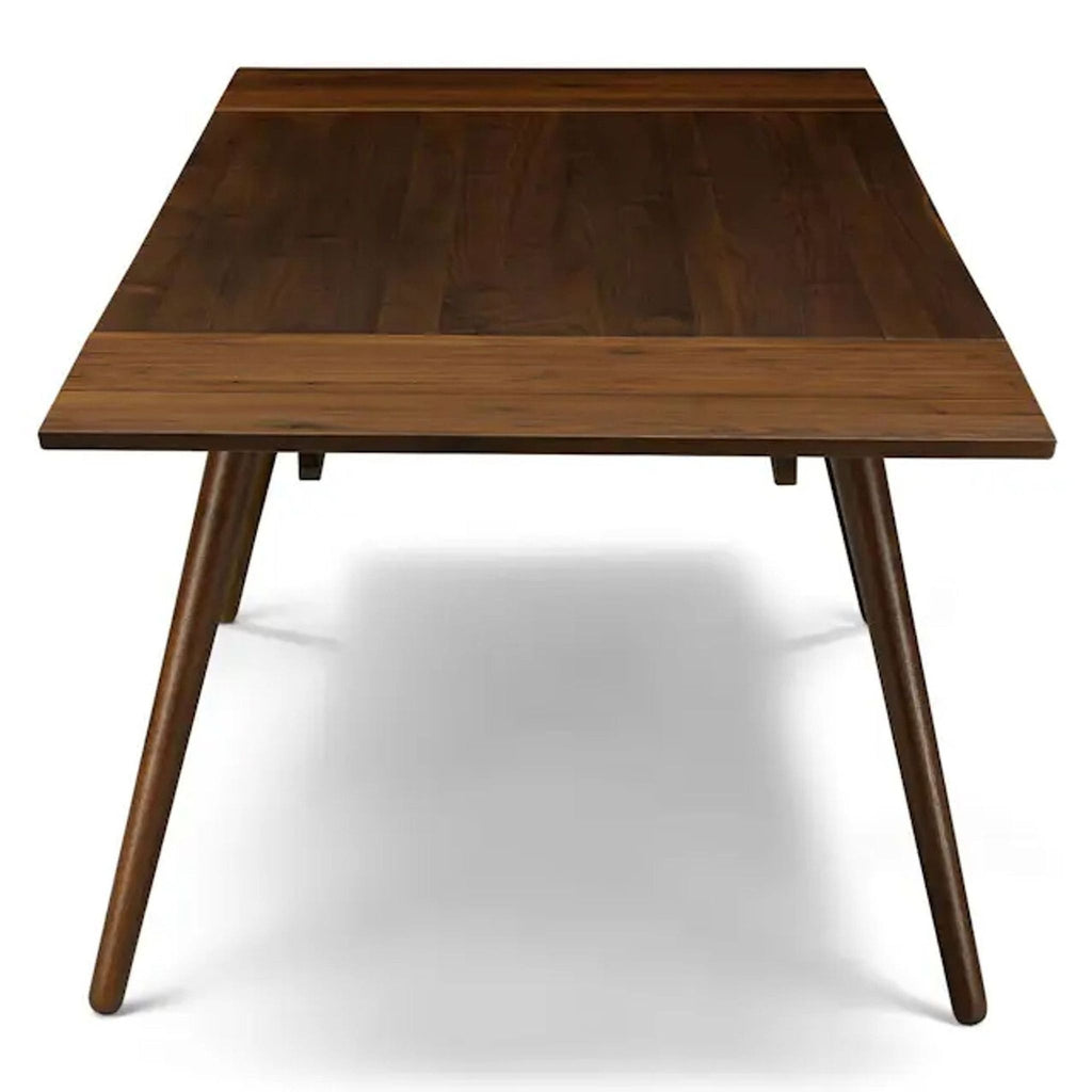 Article dining table showcasing sleek, modern design and extendable feature.