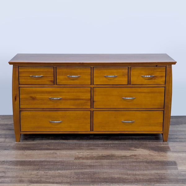 Wood dresser with 8 drawers featuring metal glides and nickel pulls.