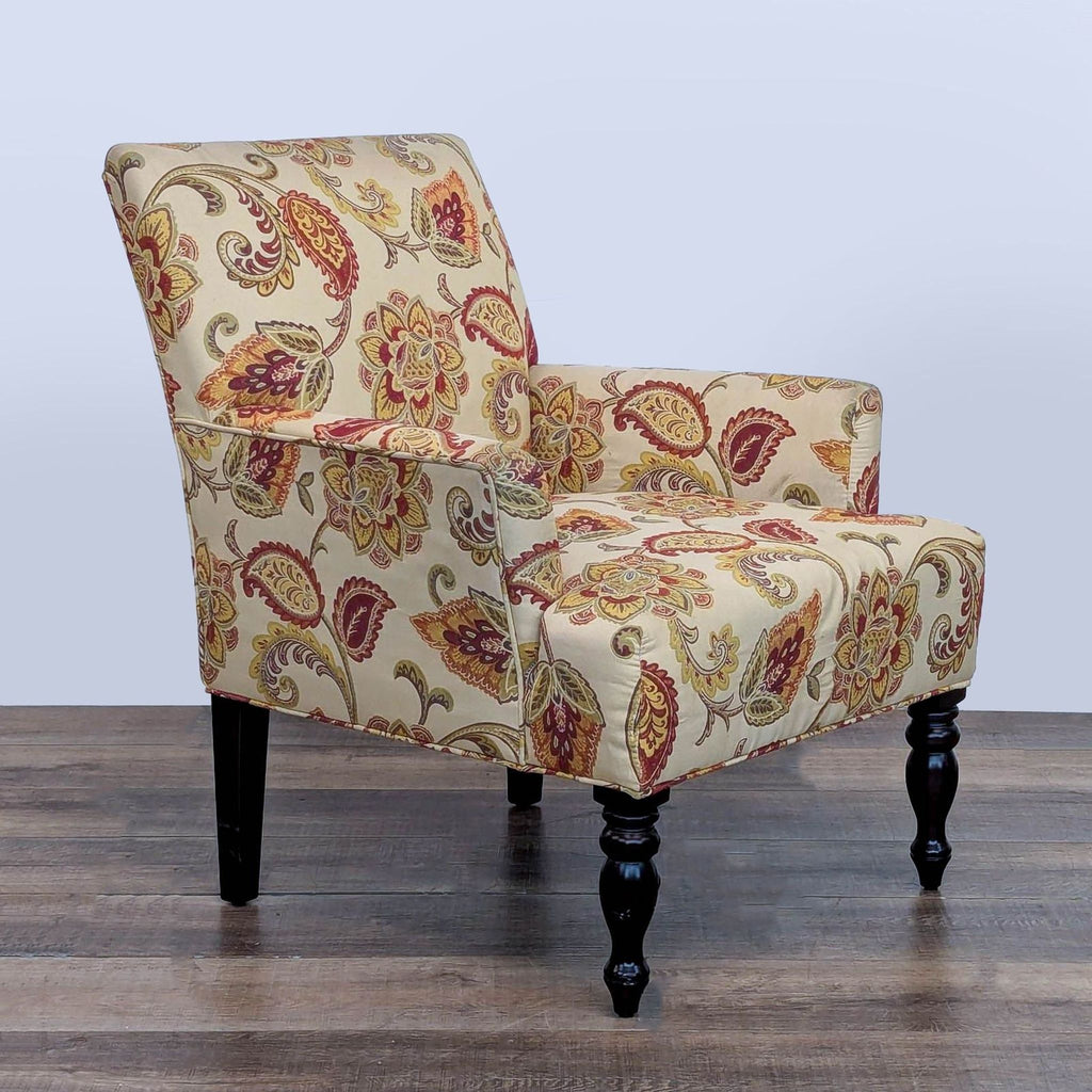 Angled view of a Reperch chair, showcasing floral upholstery and dark wood legs.