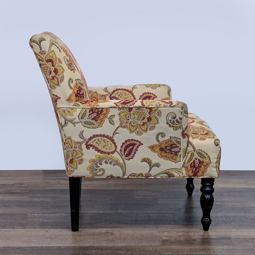 Side view of a Reperch lounge chair, featuring paisley floral design.