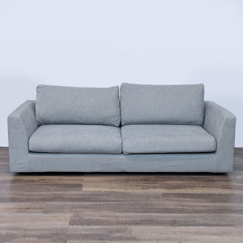 Relax Form loveseat with plush cushions, angled arms, and a modern look.