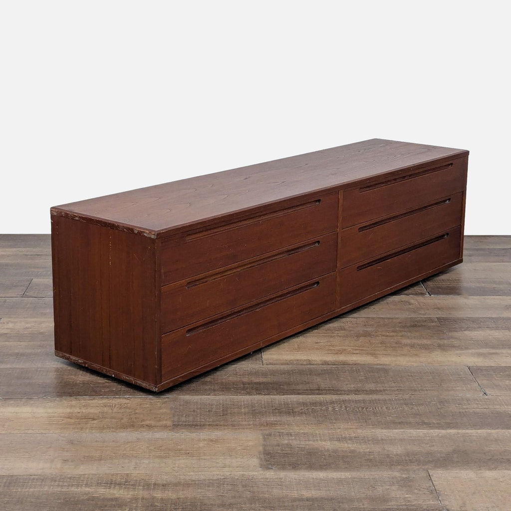 Angled view of Reperch wood dresser, highlighting recessed pull design.