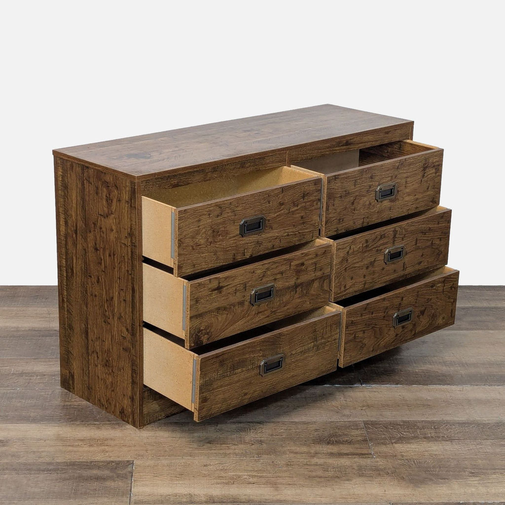 Side view of Reperch dresser showing six partially open drawers.