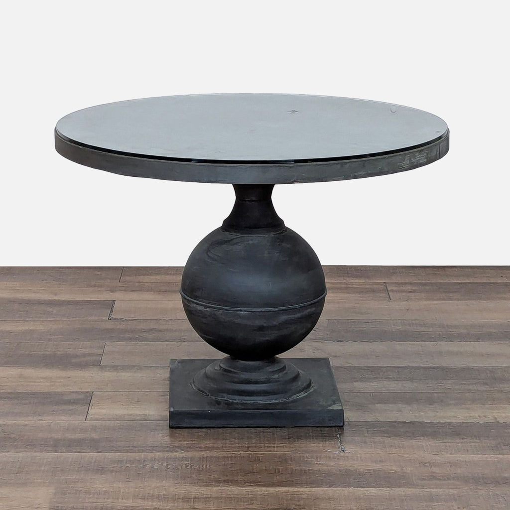1. Reperch round dining table with a glass top and a unique spherical pedestal base, for indoor or outdoor use.  