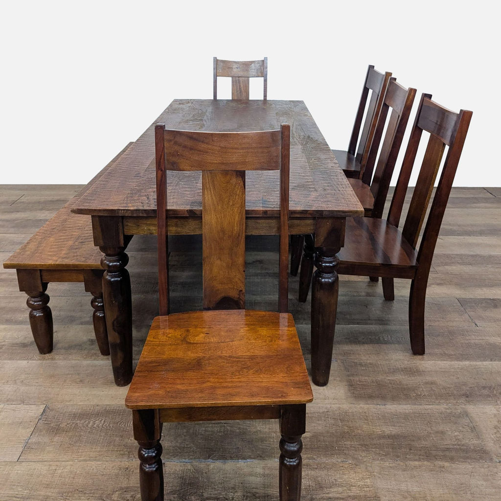 3. Dining set by World Market featuring a solid wood table, five chairs, and bench, arranged in a row.