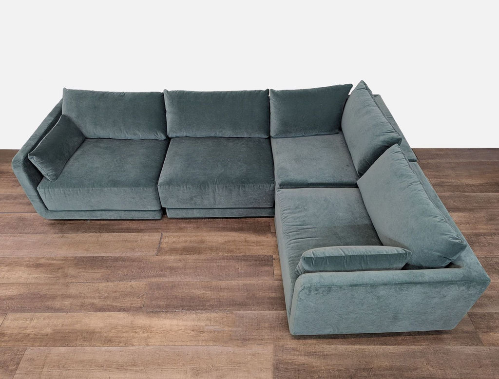 Benchmade Modern sectional featuring pillowy-soft cushions and sleek velvet upholstery for ultimate comfort.