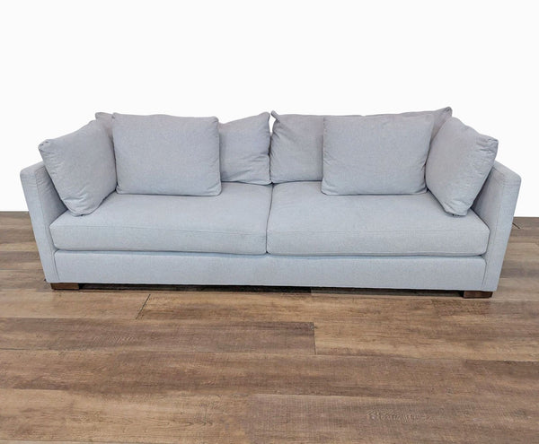 1. Three-seat Rejuvenation sofa with slim track arms and plush cushions in light cashmere performance flannel.  