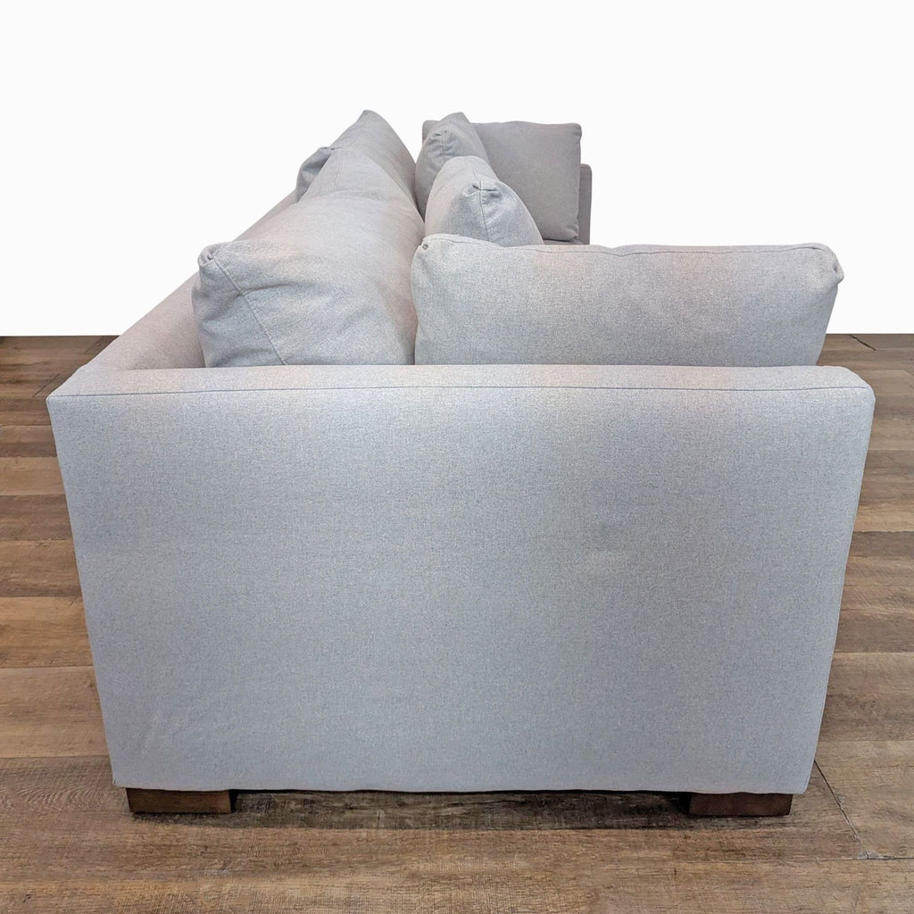 2. Side view of a Rejuvenation 3-seat sofa, highlighting slim arms and soft cashmere flannel upholstery.  