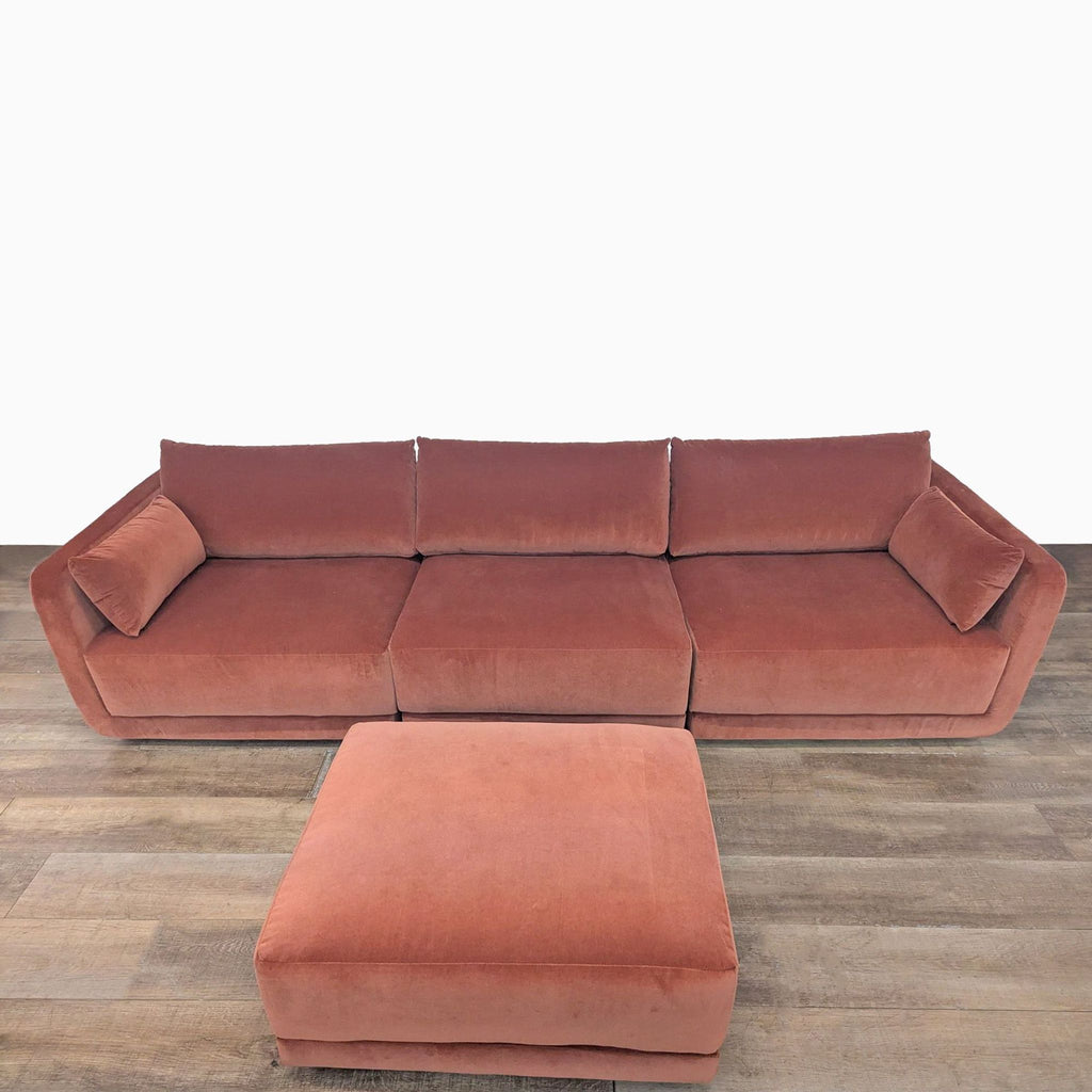 1. Front view of a BenchMade Modern Eva 3-seat modular sofa in velvet with deep cushions and matching ottoman.