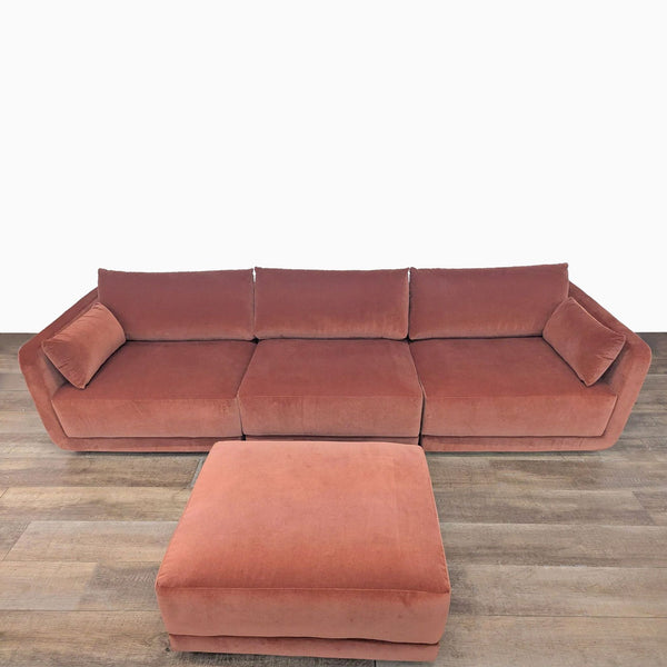1. Front view of a BenchMade Modern Eva 3-seat modular sofa in velvet with deep cushions and matching ottoman.