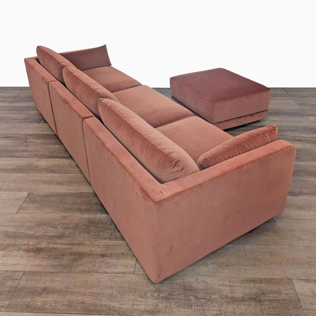 3. Rear perspective of the BenchMade Modern Eva velvet 3-seat sofa, highlighting its soft back cushions and structure.
