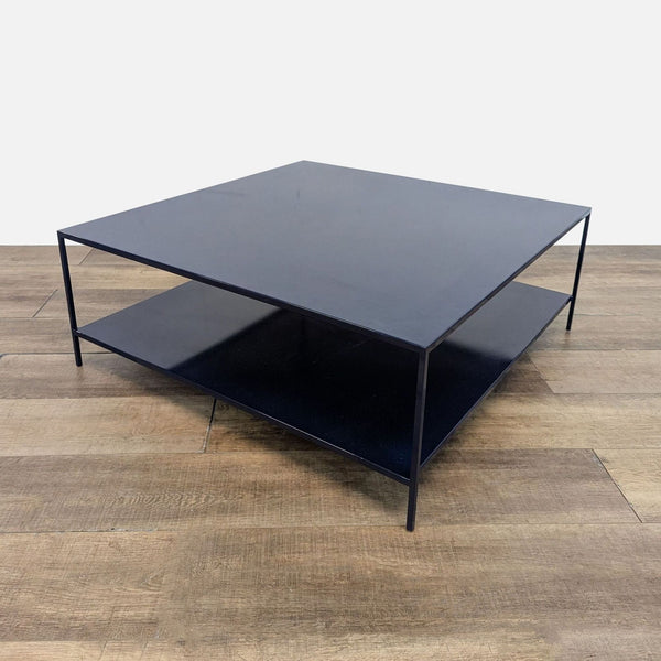 Powder-coated indigo steel coffee table with a minimalist design.